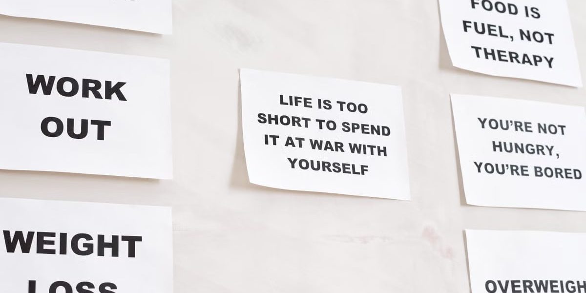 Motivational quotes on white paper promoting healthy habits and lifestyle changes.
