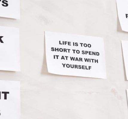 Motivational quotes on white paper promoting healthy habits and lifestyle changes.